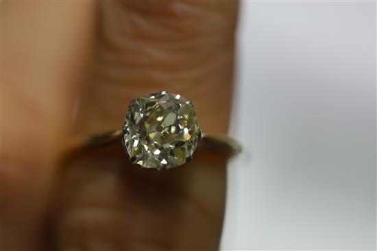 A gold and old mine cut solitaire diamond ring, size O/P.